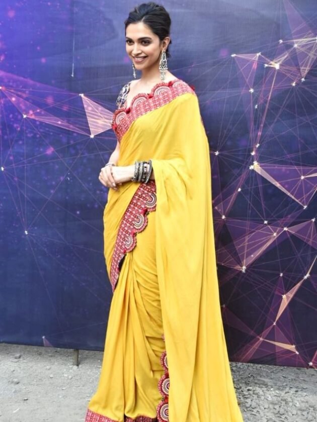 Deepika Padukone in Mustard Yellow Saree with Red Embellished Border