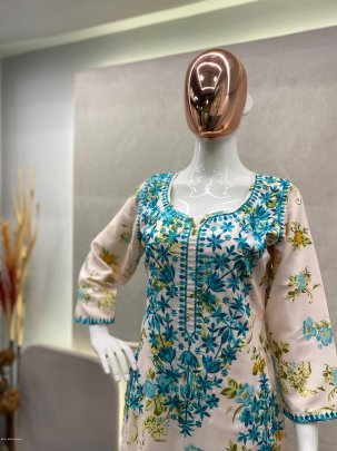 Attractive White And Blue printed rayon Kurti with cotton thread embroidered work palazzo