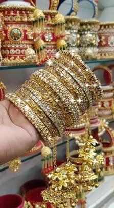 Beautiful Stone Golden Bangles Set with Jhumka Latkan