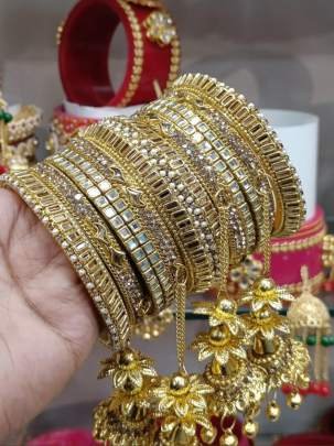 Beautiful Stone Golden Bangles Set with Jhumka Latkan