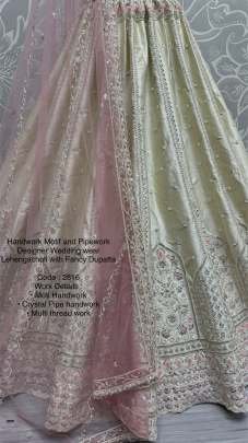 Cream Fancy Embroidery Work Marriage Lehenga Choli With Dupatta