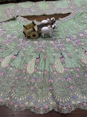 Exclusive Pista Soft Butterfly Net Lehenga Choli With 4 Meter Flair