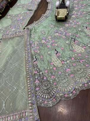 Exclusive Pista Soft Butterfly Net Lehenga Choli With 4 Meter Flair