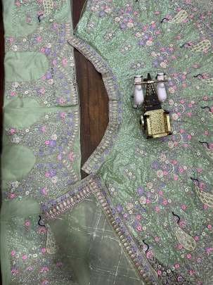 Exclusive Pista Soft Butterfly Net Lehenga Choli With 4 Meter Flair