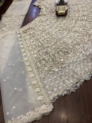 Presenting Wedding Wear Beautiful Butterfly Net Beige Lehenga