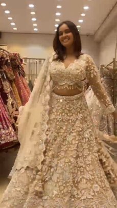 Presenting Wedding Wear Beautiful Butterfly Net Beige Lehenga