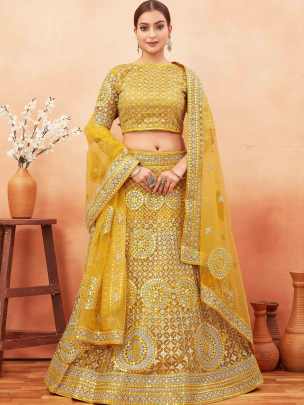Wedding Wear Yellow Color Stone and Embroidered Work Net Lehenga choli