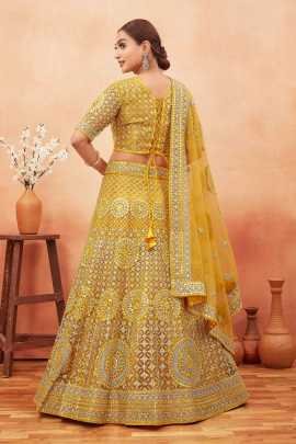 Wedding Wear Yellow Color Stone and Embroidered Work Net Lehenga choli