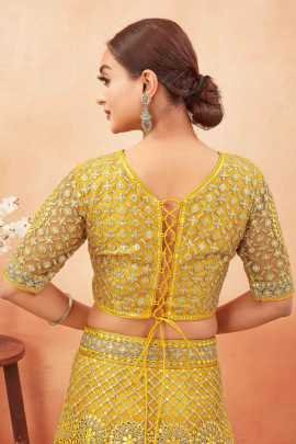 Wedding Wear Yellow Color Stone and Embroidered Work Net Lehenga choli